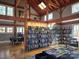 Cozy interior featuring high ceilings, exposed beams, skylights, bookshelves, and comfortable seating at 525 Cellini Pl, Mount Holly, NC 28120