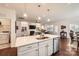 Beautiful kitchen with island, stainless steel appliances, and seamless flow to the living area at 525 Cellini Pl, Mount Holly, NC 28120
