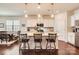 Well-lit kitchen featuring an island with bar stools, stainless steel appliances, and modern finishes at 525 Cellini Pl, Mount Holly, NC 28120