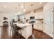 Modern kitchen with white cabinets, stainless steel appliances, and an island with seating at 525 Cellini Pl, Mount Holly, NC 28120