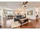Spacious living area seamlessly connecting to dining and kitchen, featuring hardwood floors and ample natural light at 525 Cellini Pl, Mount Holly, NC 28120