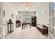 Bright office space featuring natural light, neutral walls, ceiling fan, and classic dark wood furnishings at 525 Cellini Pl, Mount Holly, NC 28120