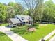 Beautiful home with a spacious yard, complemented by mature trees and a lengthy driveway at 5344 Saddlewood Ln, Mint Hill, NC 28227