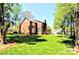 Backyard of home features lush landscaping and mature trees at 5344 Saddlewood Ln, Mint Hill, NC 28227