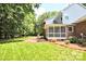 Enjoy the home's beautiful backyard, featuring a screened porch and well-maintained lawn at 5344 Saddlewood Ln, Mint Hill, NC 28227