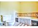 Bathroom with a tiled bath and toilet, featuring neutral walls and tile flooring, and a matching accent border at 5344 Saddlewood Ln, Mint Hill, NC 28227