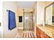 Bathroom featuring a glass shower, granite countertops and cabinets, complete with modern fixtures and a towel rack at 5344 Saddlewood Ln, Mint Hill, NC 28227