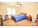 Bedroom with neutral walls and carpet, featuring a double bed and window for natural light at 5344 Saddlewood Ln, Mint Hill, NC 28227