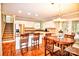 Open kitchen boasts granite countertops, stainless steel appliances, and a breakfast bar at 5344 Saddlewood Ln, Mint Hill, NC 28227