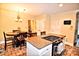 Spacious kitchen featuring a granite island, stainless appliances, and eat-in dining area at 5344 Saddlewood Ln, Mint Hill, NC 28227