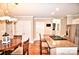 Eat-in kitchen features granite countertops, stainless steel appliances, and an adjacent dining area at 5344 Saddlewood Ln, Mint Hill, NC 28227