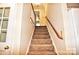 Carpeted staircase leads to the upper level at 5344 Saddlewood Ln, Mint Hill, NC 28227