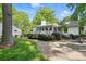 Outdoor patio area with white railings, ideal for outdoor entertaining and enjoying the serene backyard scenery at 5400 Glenham Dr, Charlotte, NC 28210