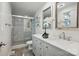 Modern bathroom featuring a double vanity, glass shower, and elegant fixtures at 5400 Glenham Dr, Charlotte, NC 28210