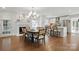Elegant dining room with a fireplace, chandelier lighting, and a beautiful dining table set for a cozy meal at 5400 Glenham Dr, Charlotte, NC 28210