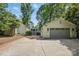 Long driveway leading to a detached garage and home, providing ample parking and a sense of privacy at 5400 Glenham Dr, Charlotte, NC 28210