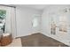 Bright foyer with hardwood floors, white trim, and glass-paneled doors at 5400 Glenham Dr, Charlotte, NC 28210