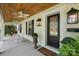 Inviting covered porch features rocking chairs, swing, and stylish lighting fixtures at 5400 Glenham Dr, Charlotte, NC 28210