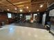 Converted garage with painted floors, paneled walls, and a home gym setup at 5400 Glenham Dr, Charlotte, NC 28210
