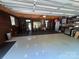 Spacious garage featuring painted floors, paneled walls, and a home gym setup at 5400 Glenham Dr, Charlotte, NC 28210