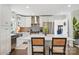 A well-equipped kitchen with stainless steel appliances, a tile backsplash, and a breakfast bar for casual dining at 5400 Glenham Dr, Charlotte, NC 28210