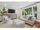 Cozy living room featuring large window, comfortable seating, and modern décor at 5400 Glenham Dr, Charlotte, NC 28210