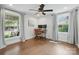 Bright office space featuring hardwood floors, natural light, and a ceiling fan at 5400 Glenham Dr, Charlotte, NC 28210