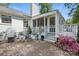 Charming patio area with brick pavers, screened porch, and beautiful landscaping at 5400 Glenham Dr, Charlotte, NC 28210