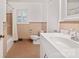 Well-lit bathroom with ceramic floors, peach colored walls, white fixtures and a window with shutters at 631 Dogwood Rd, Statesville, NC 28677