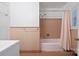 Neutral bathroom featuring a shower/tub combination with peach tile and white fixtures at 631 Dogwood Rd, Statesville, NC 28677