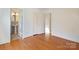 Bedroom view highlighting hardwood floors, a closet, and an adjacent bathroom at 631 Dogwood Rd, Statesville, NC 28677