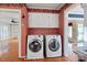 Convenient laundry room with washer and dryer, with a view of the kitchen and living room at 631 Dogwood Rd, Statesville, NC 28677