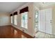 Bright living room featuring gleaming hardwood floors, ample natural light, and neutral wall color at 631 Dogwood Rd, Statesville, NC 28677