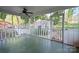 Cozy screened porch with fan overlooking backyard and detached shed, great for outdoor enjoyment at 631 Dogwood Rd, Statesville, NC 28677