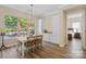 Light filled dining area with a view of pool, featuring built-in cabinets and beverage cooler at 650 Tallulah Falls Dr, Denver, NC 28037