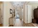 Inviting foyer with hardwood floors, neutral walls, and decorative accents, leading to the rest of the home at 650 Tallulah Falls Dr, Denver, NC 28037