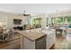 Open-concept kitchen flows into a living room and features a breakfast bar for additional seating at 650 Tallulah Falls Dr, Denver, NC 28037