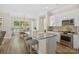 Bright eat-in kitchen featuring granite countertops, stainless appliances, and a view of the backyard at 650 Tallulah Falls Dr, Denver, NC 28037