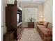 Comfortable living room with sofa, TV cabinet, and natural light, creating a relaxing and inviting space at 650 Tallulah Falls Dr, Denver, NC 28037