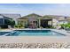 Backyard pool with stone surround, outdoor dining area, and a screened-in porch for relaxing by the pool at 650 Tallulah Falls Dr, Denver, NC 28037