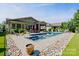 Relaxing backyard with a pool and spa area, plus plenty of seating for outdoor enjoyment at 650 Tallulah Falls Dr, Denver, NC 28037