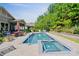 A pristine swimming pool and spa offer a refreshing escape, surrounded by lush landscaping at 650 Tallulah Falls Dr, Denver, NC 28037