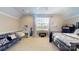 Bright bedroom with a large window, a cozy futon, and a desk, creating a comfortable and functional space at 708 Ridgelake Dr, Weddington, NC 28104