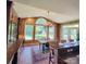 Bright dining area with views of the landscaped backyard, elegant chandelier and decor at 708 Ridgelake Dr, Weddington, NC 28104