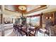 Formal dining room with a large wooden table, seating for ten, decorative wallpaper, and a chandelier at 708 Ridgelake Dr, Weddington, NC 28104