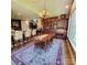 Open concept dining room with a built in bar, large table, and access to the backyard at 708 Ridgelake Dr, Weddington, NC 28104