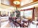 Bright dining room with large windows, decorative wallpaper, chandelier and an inviting seating area at 708 Ridgelake Dr, Weddington, NC 28104