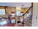 Elegant foyer with hardwood floors, fireplace, staircase, and light-filled windows showcasing the home's architectural details at 708 Ridgelake Dr, Weddington, NC 28104