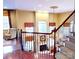 Grand foyer showcasing hardwood floors, elegant staircase, and a view of the living area fireplace at 708 Ridgelake Dr, Weddington, NC 28104