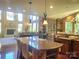 Gourmet kitchen with granite countertops, large island, and high-end appliances at 708 Ridgelake Dr, Weddington, NC 28104